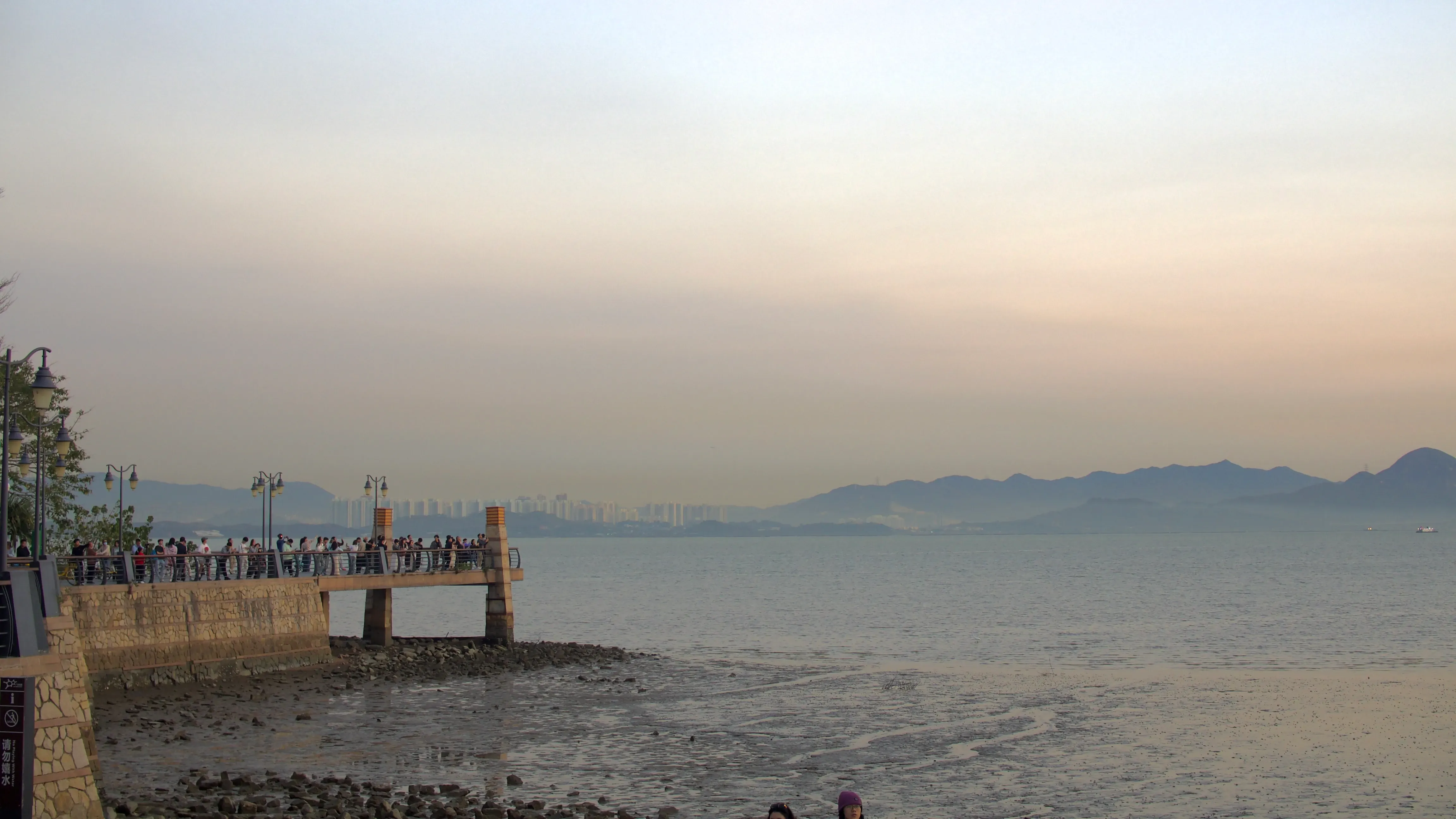 People taking photo of the sunset at Shenzhen Bay Park Pier